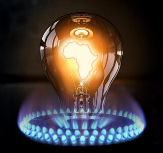 A filament lightbulb, with a glowing image of the African continent overlaid on the filament, surrounded by a lit gas hob